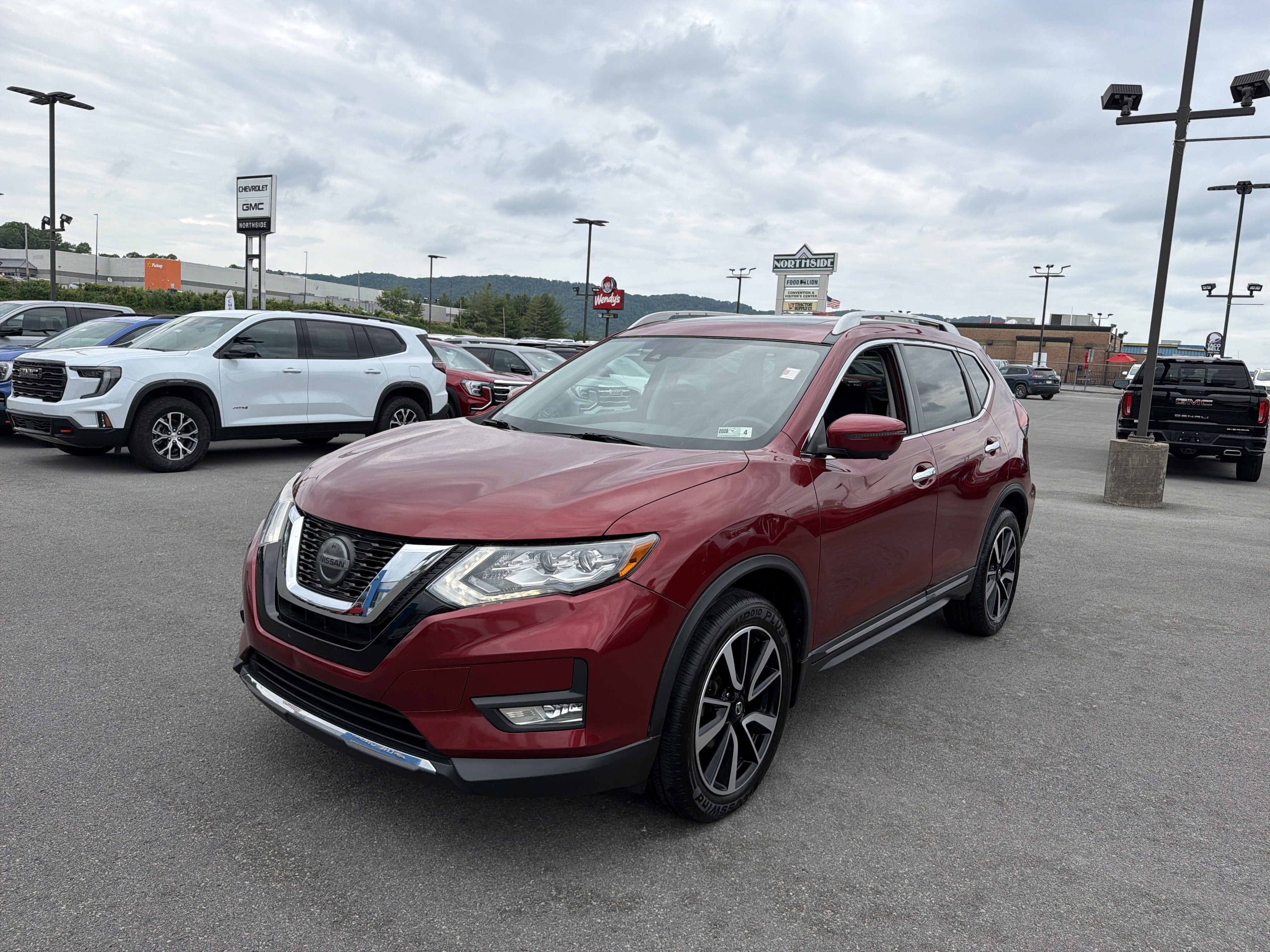 2019 Nissan Rogue SL in Scarlet Ember Tin — front three-quarter view
