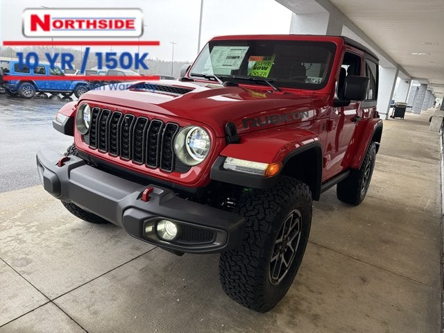 2026 Jeep Wrangler Rubicon in Firecracker Red Clear-Coat Exterior Paint — front three-quarter view