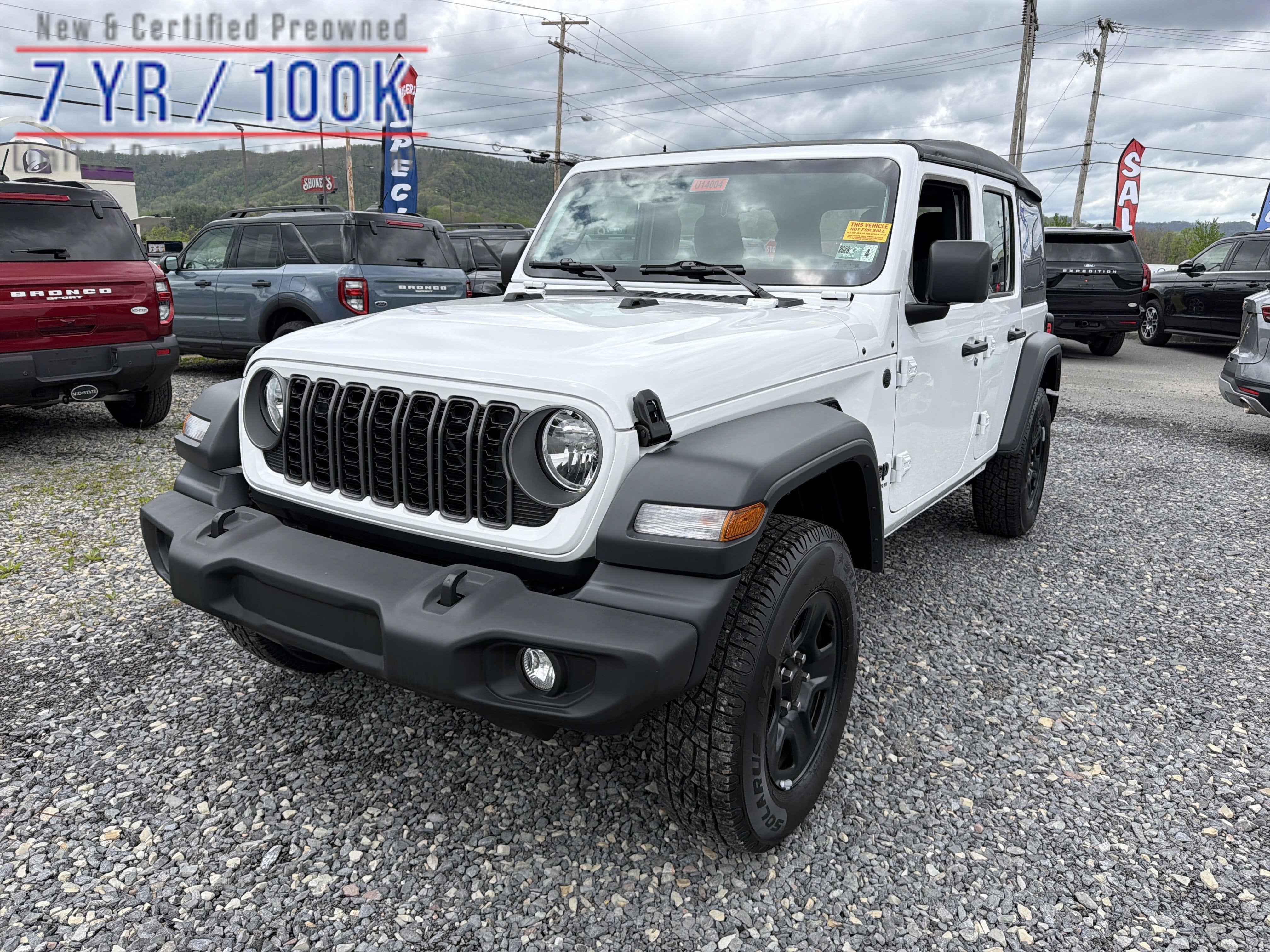 2026 Jeep Wrangler Sport in Bright White Clearcoat — front three-quarter view