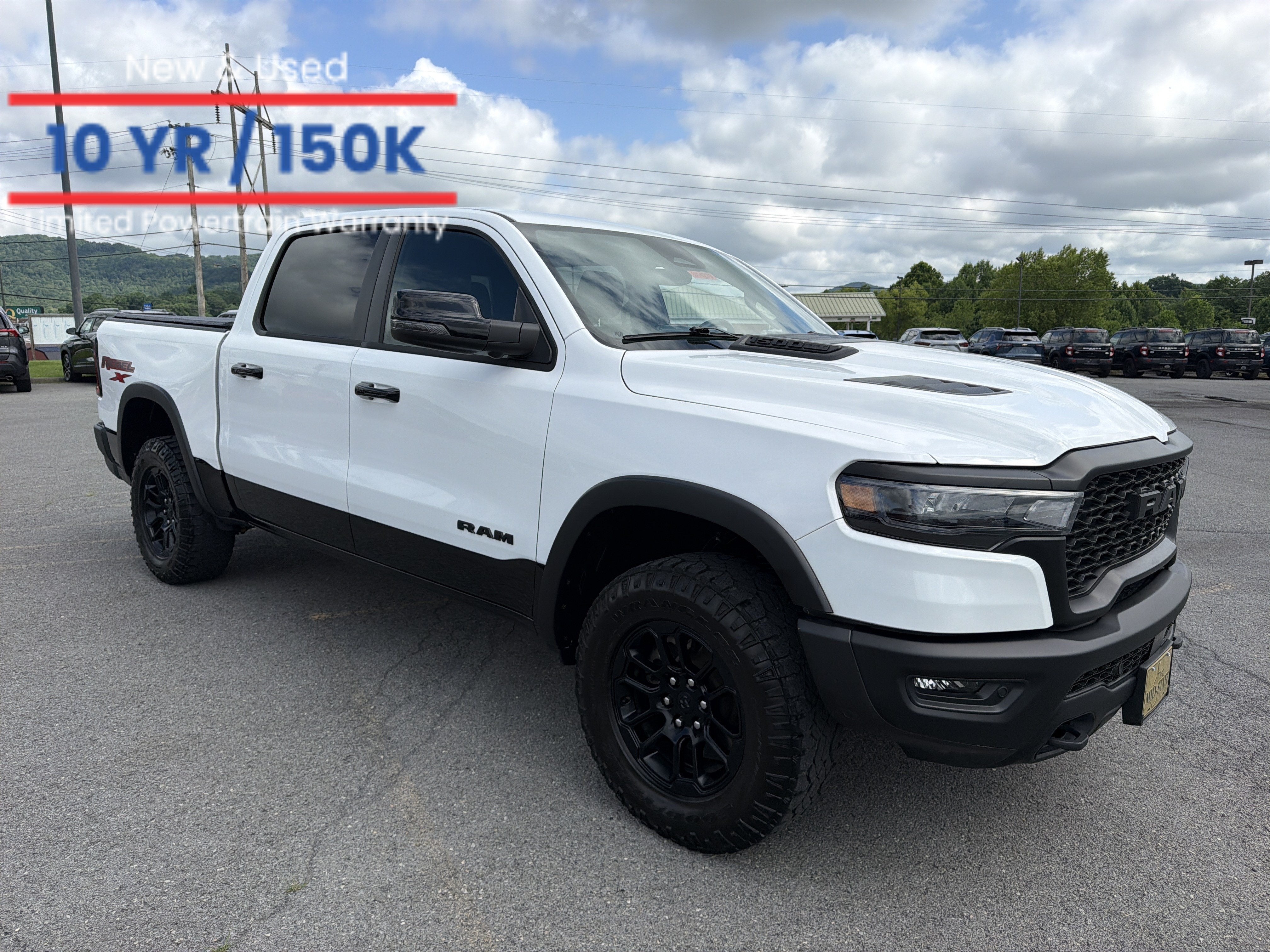 2025 RAM 1500 Rebel in Bright White Clearcoat — front three-quarter view