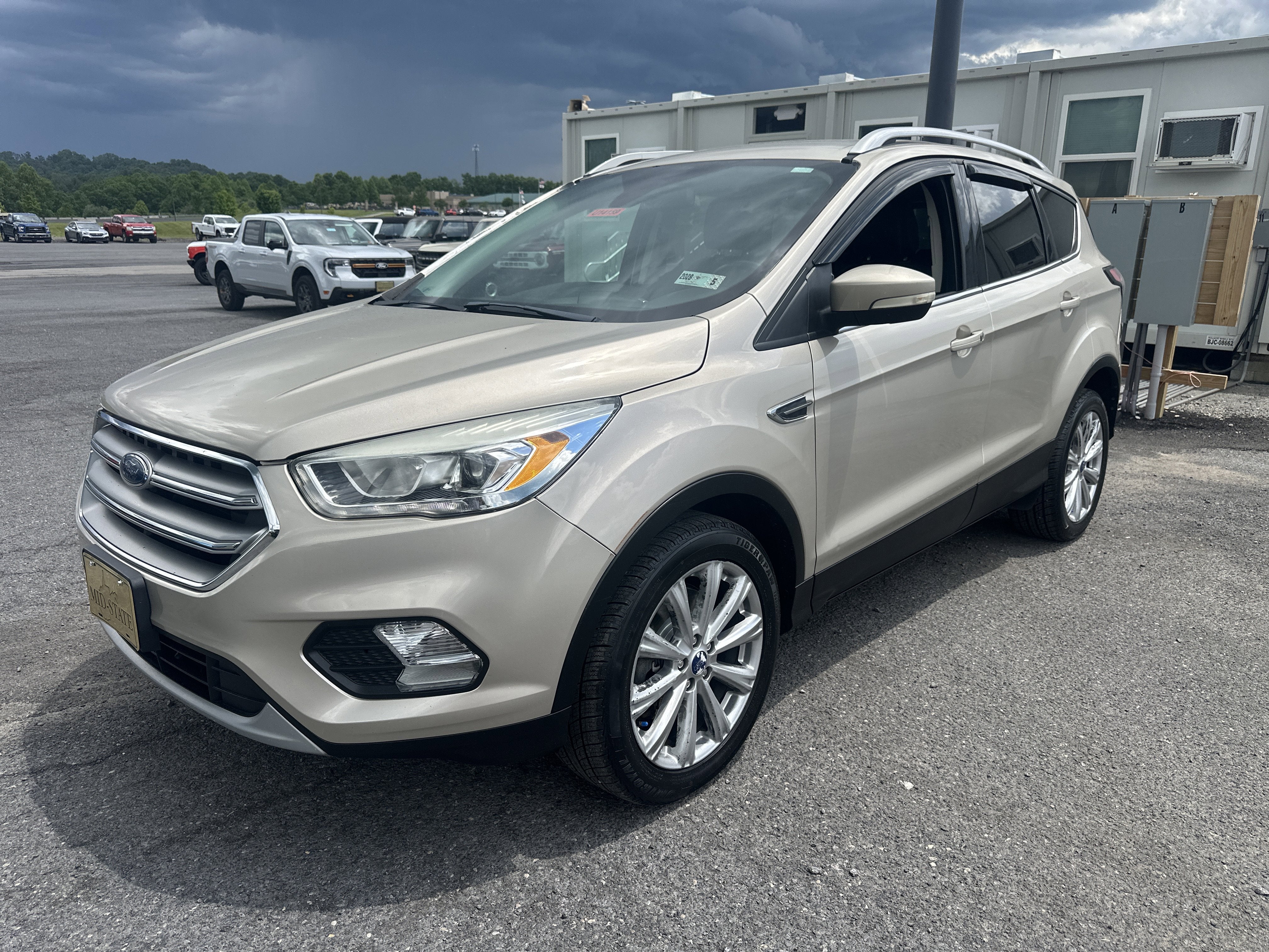 2017 Ford Escape Titanium in White Gold Metallic — front three-quarter view