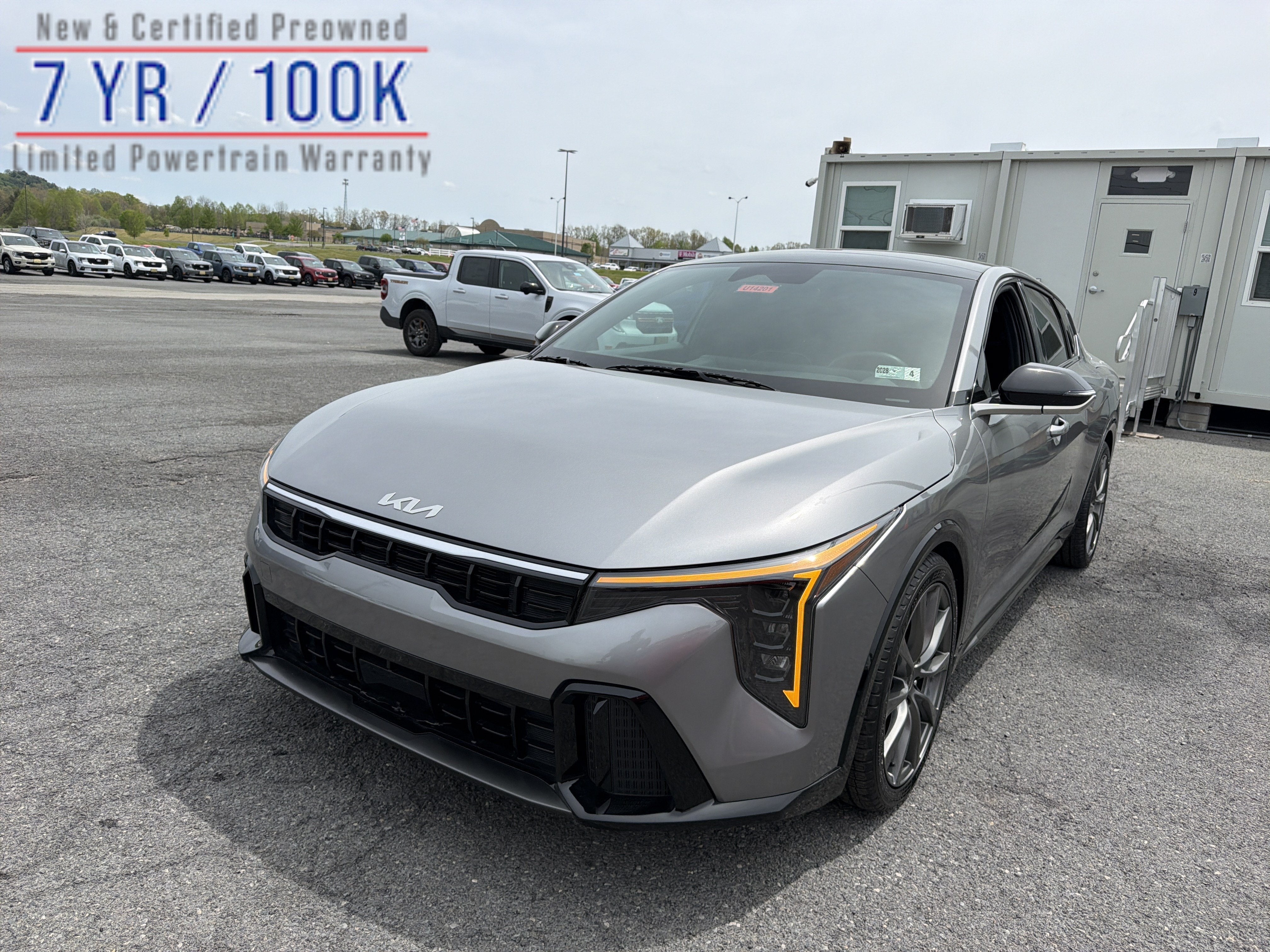 2025 Kia K4 GT-Line in Steel Gray — front three-quarter view
